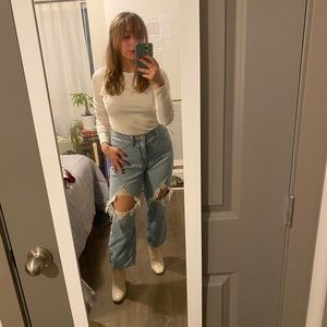 Flared, distressed, light wash jeans. Size 2 but fits more like a four.